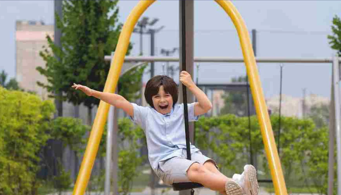 Children's play area with swing